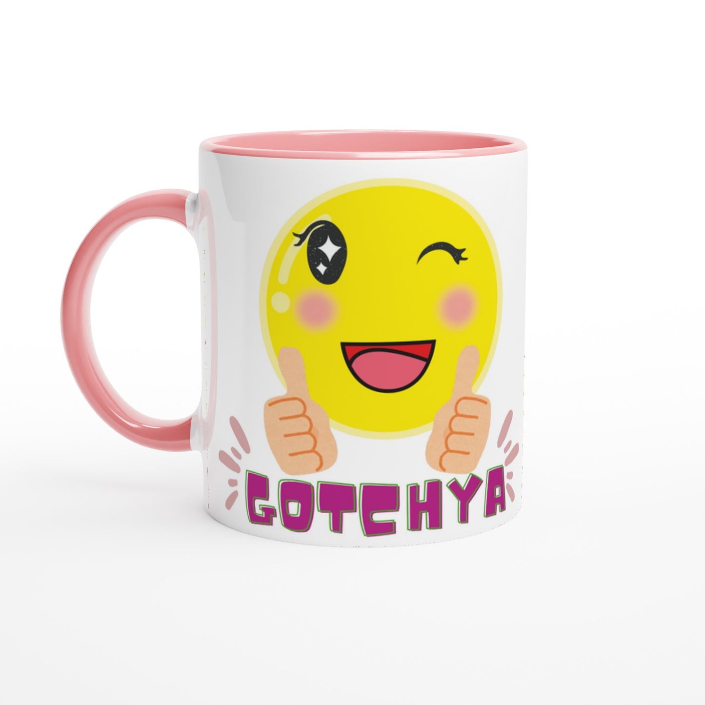 White ceramic mug with pink inside and rim with a colorful printed design of an emoji winking and smiling saying GOTCHYA. 