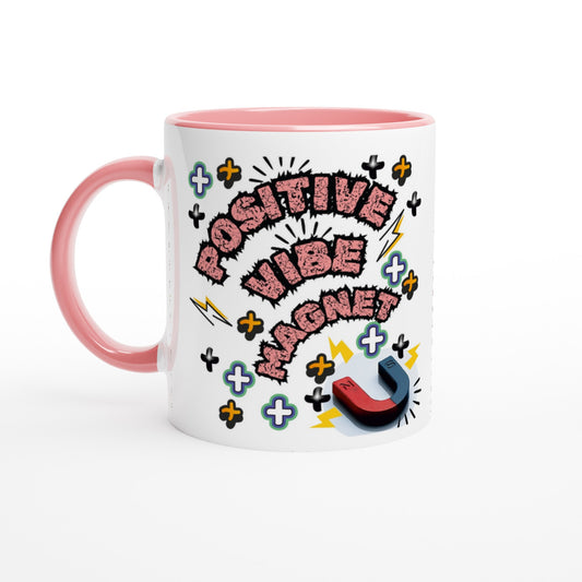 White ceramic mug with pink inside and handle with printed text saying POSITIVE VIBE MAGNET, next to an image of a magnet.