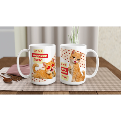 Two white ceramic mugs on a counter, with a male and a female cat with a love theme funny text. Front vue
