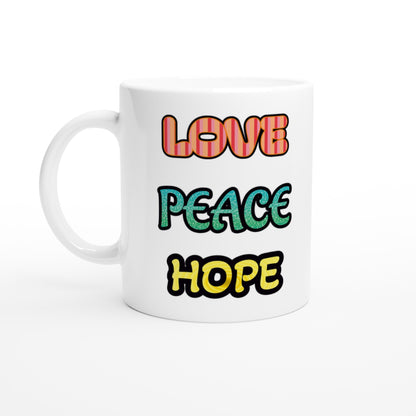 White ceramic mug with bright colored three words: LOVE , PEACE, HOPE.